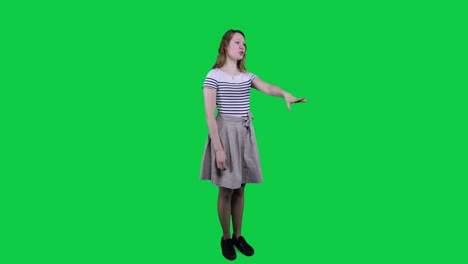 side view, teenage girl singing, vibing to music in front of a green screen