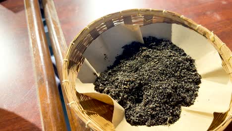 Silkworm eggs showcased in a woven basket