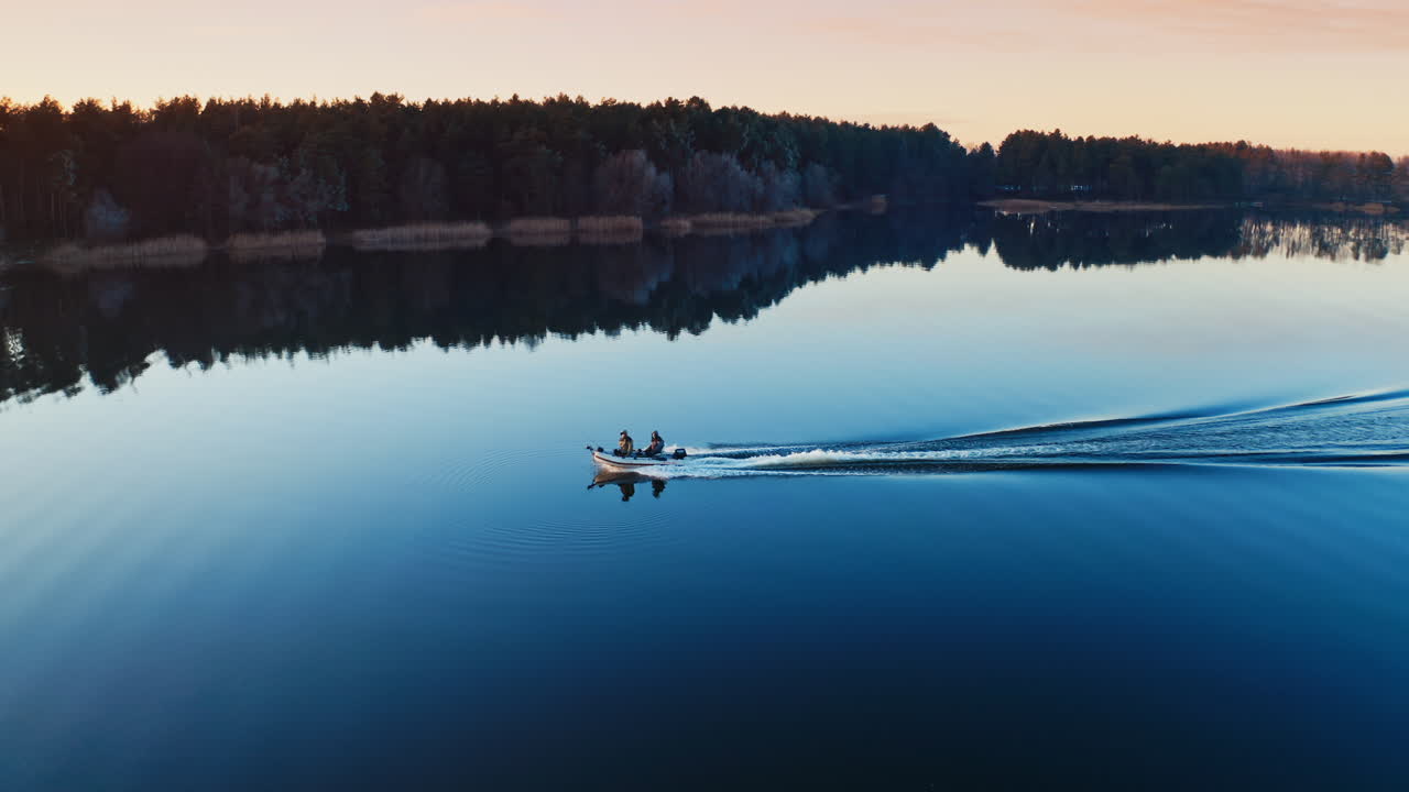 Boat sails on the river. Aerial view of the river and sailing boat
