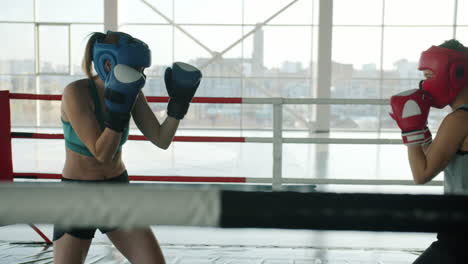 women boxing training session in a ring