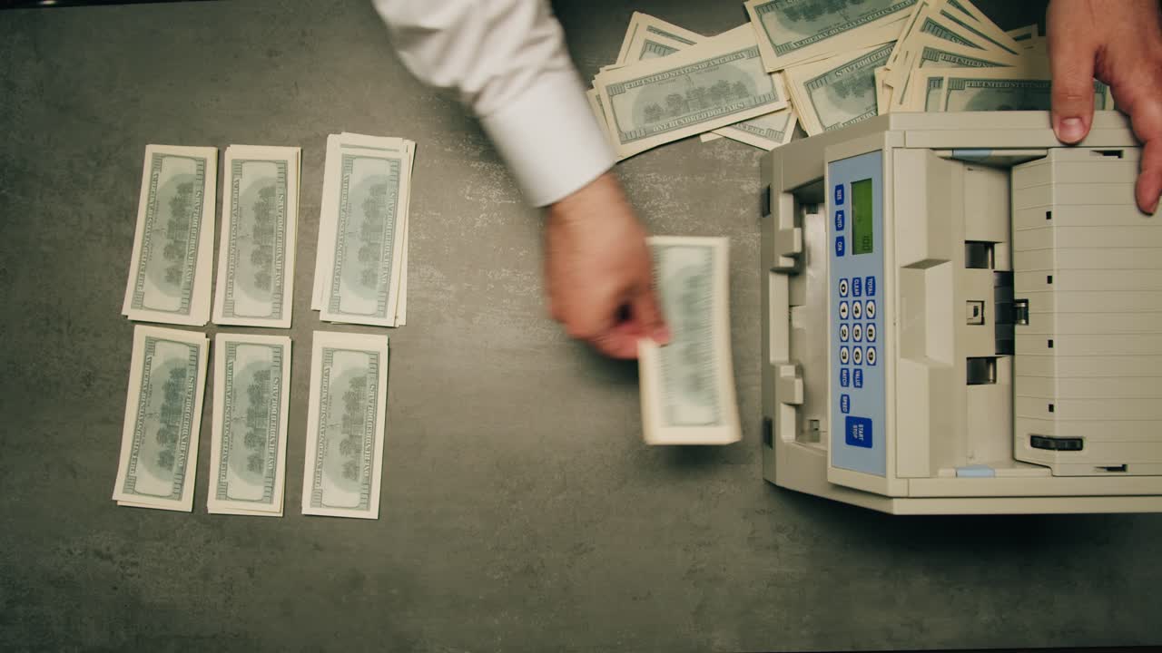 Specialised police officer Counting dollar banknotes in crime lab, conceptual image. High quality 4k footage