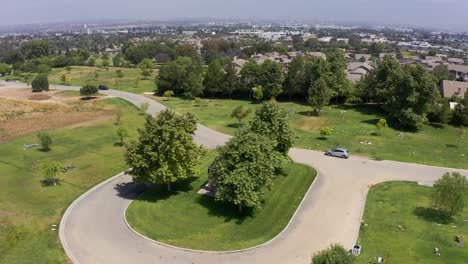 Aerial-wide-panning-shot-of-a-decorative-gazebo-at-a-mortuary-in-California