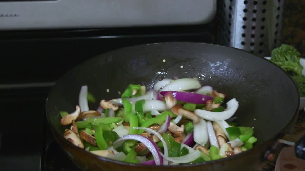 Flipping Vegetables In Pan While Cooking
