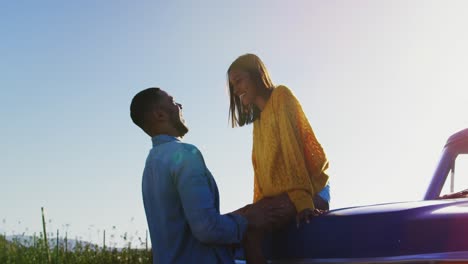 young couple on a road trip in their pick-up truck