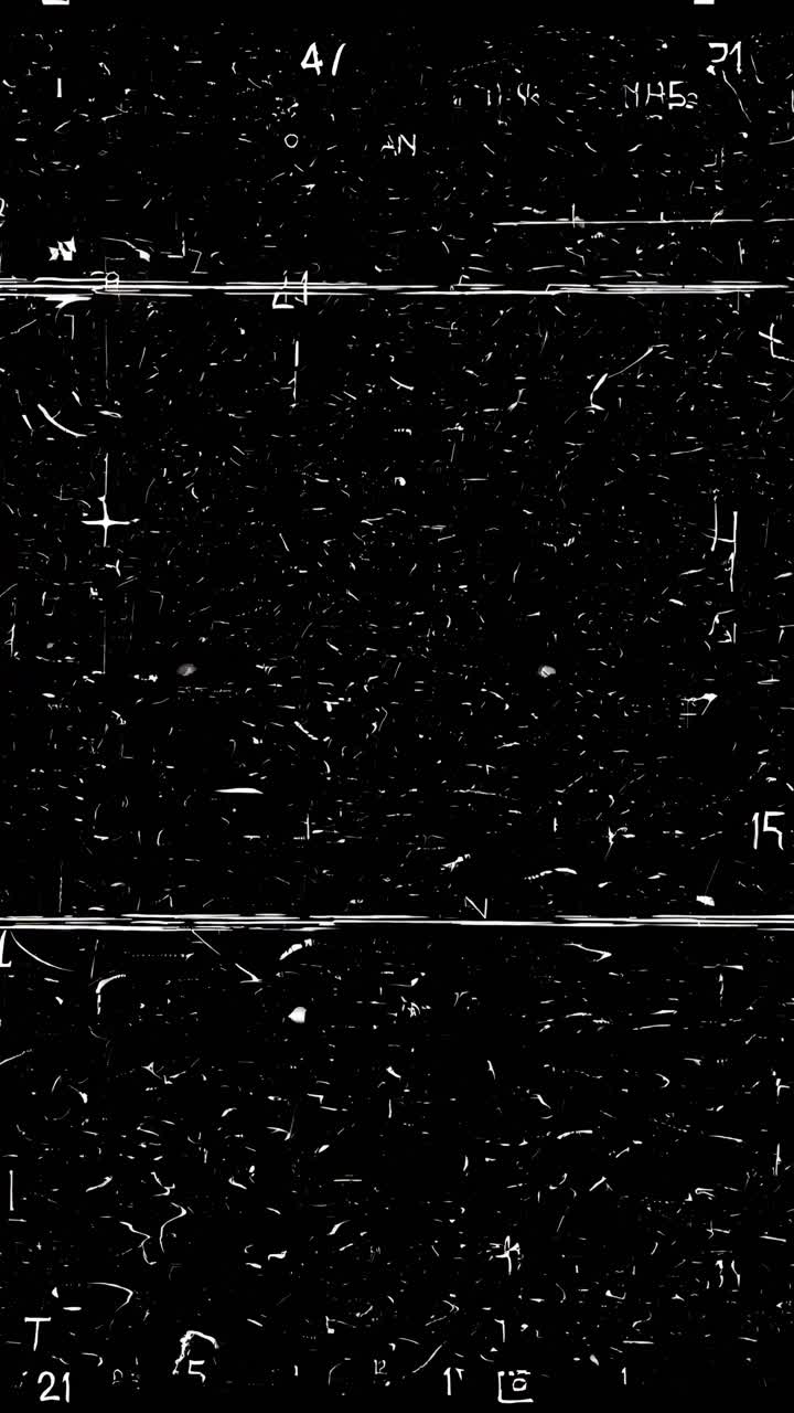 Abstract video concept with a top-down angle, showcasing scattered white letters on a black