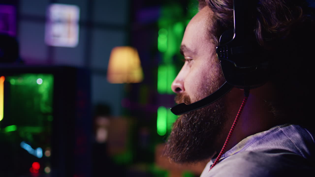 Man having gaming session with online friends, using powerful computer to play game