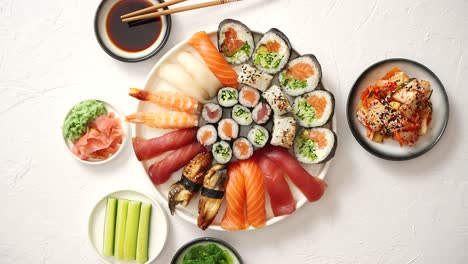 Various-sushi-rolls-placed-on-round-ceramic-plate