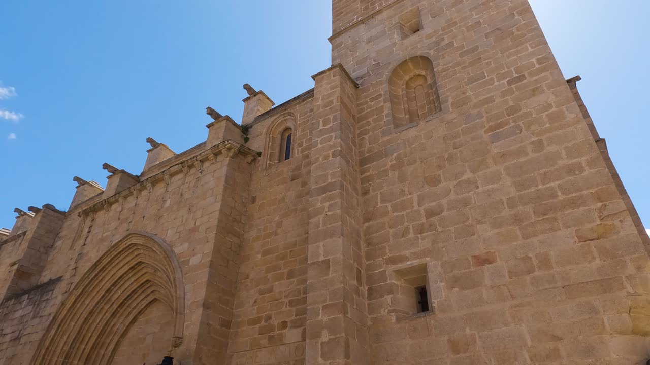 Pan shot along Santa Maria cathedral Facade on Sunny day, Spain