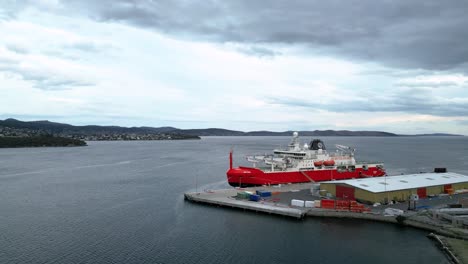 rsv nuyina australia icebreaker at port push in wide sky drone shot 50fps