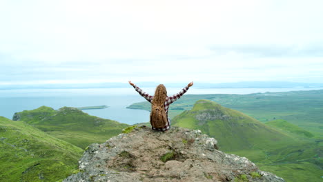 woman hiking in scenic mountains by the sea