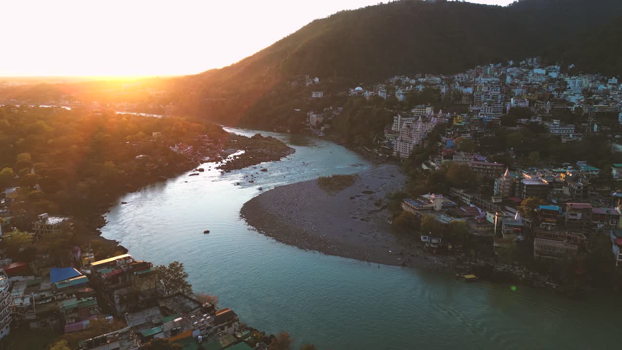 aerial view of the sacred city of Rishikesh and it important Ganges River at sunset - Uttarakhand, India