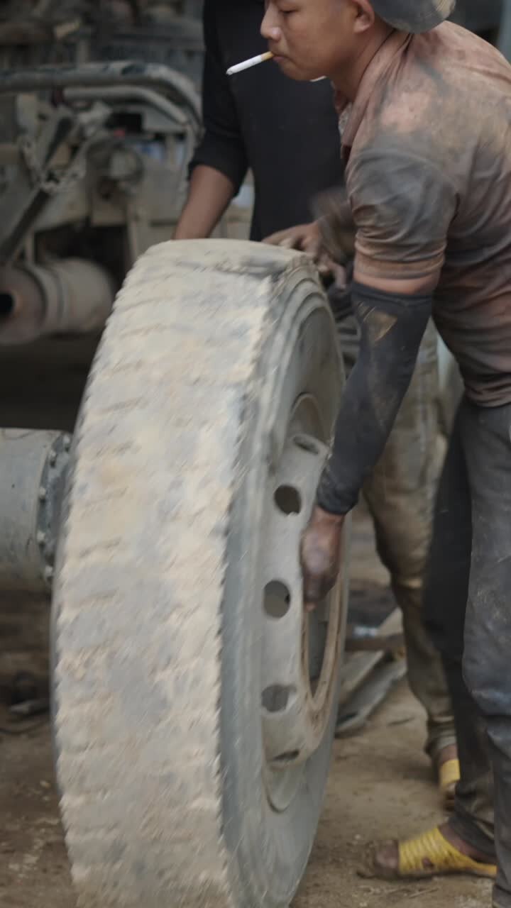 Mechanic working on a truck tire