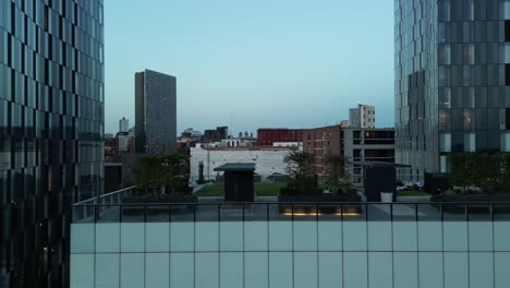 aerial drone flight along the elizabeth tower rooftop garden in manchester city centre