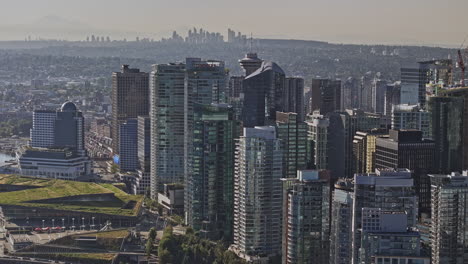 vancouver bc canada aerial v84 zoomed shot drone elevation flyover capturing downtown cityscape with towering skyscrapers and eastside burnaby views - shot with mavic 3 pro cine - july 2023