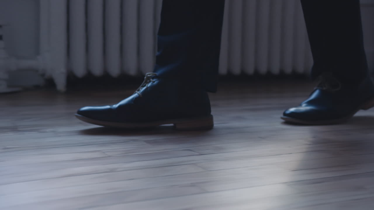 A person walks on the wood floor
