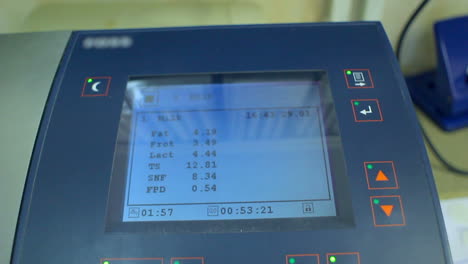 display of laboratory equipment for milk analysis. screen with analysis results