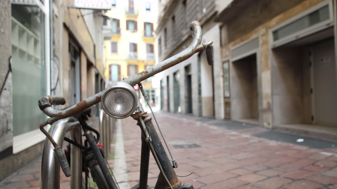 Old bicycle on the city street, establisher blurred background