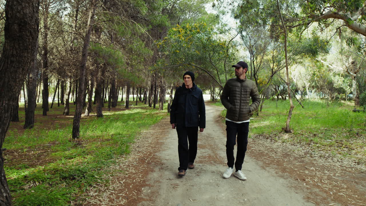 On Father's Day, a walk with his son under the trees