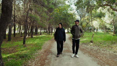 on father's day, a walk with his son under the trees