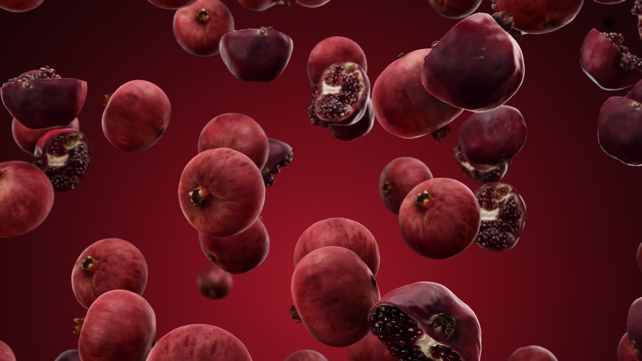 Falling pomegranate on a red background