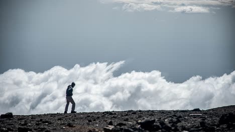 cinemagraph of a man walking along a ridge on mount kilimanjaro