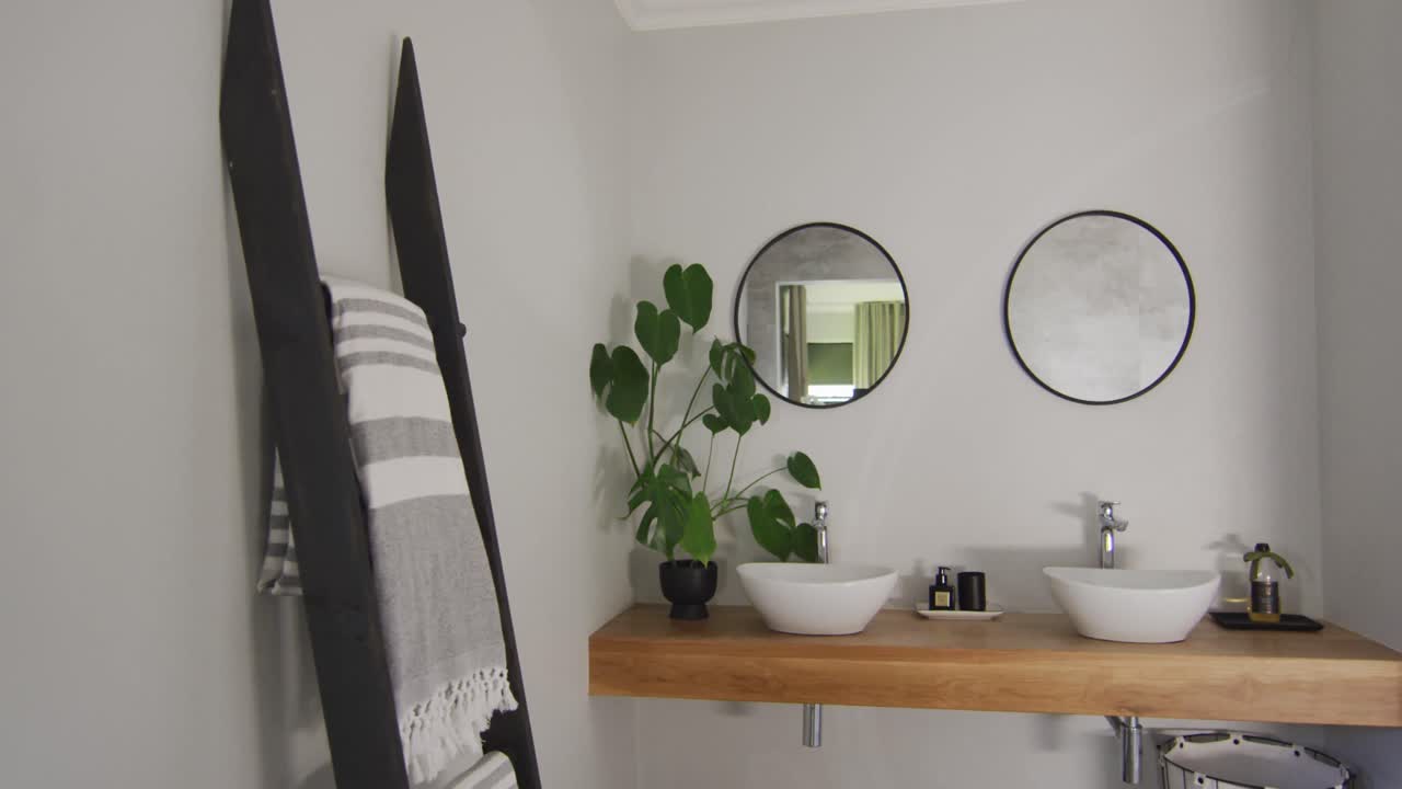 General view of luxury bathroom with washbasin and mirrors
