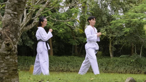 young couple kicking outdoors