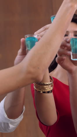 group of friends drinking shots