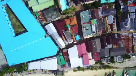 Koh-Phi-Phi-Top-Down-View-Over-Coastal-Town-with-Longtail-Boats,-Thailand