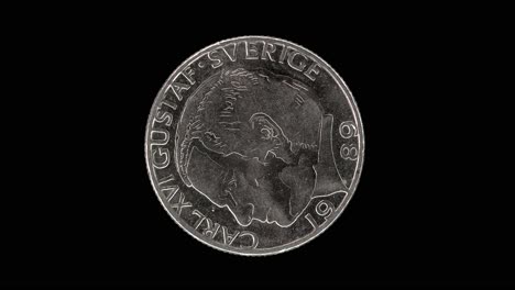 sweden 1989 1 krona coin obverse with stylized profile portrait of king carl xvi gustaf rotating on black background