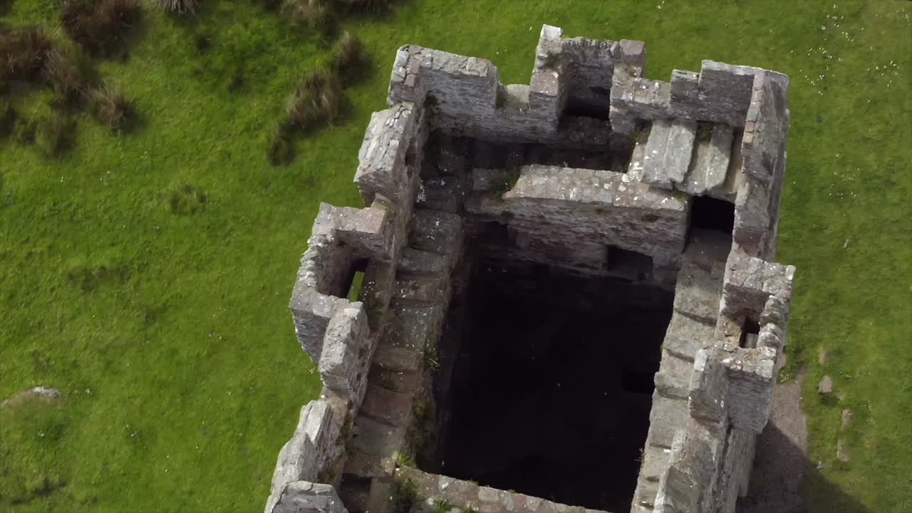 Aerial top down perspective into Grace O'Malley's Towerhouse, achill island ireland