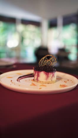 close-up of dessert with blueberry topping in luxury restaurant service