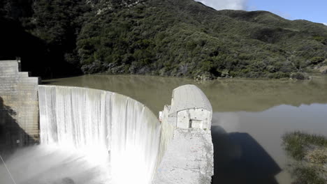 side view from above matilija creek spilling over the obsolete matilija dam after a spring storm near ojai california