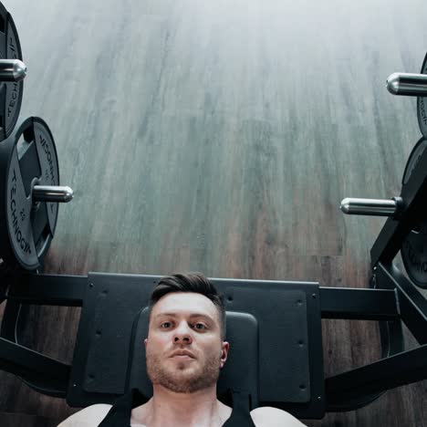 man using barbell in the gym. professional athlete doing workout with barbell in the hardcore gym