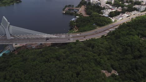 Drone-shot-of-the-Durgam-Cheruvu-Cable-Bridge-on-the-Durgam-Cheruvu-Lake-connecting-Jubilee-Hills-and-the-Madhapur,-Hyderabad-City,-India