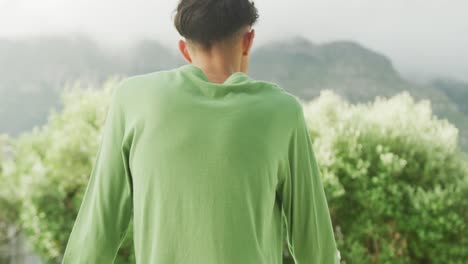 slow motion video of african american man wearing green long sleeve shirt with copy space