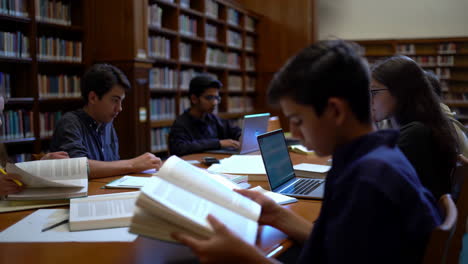 students studying and reading in a library