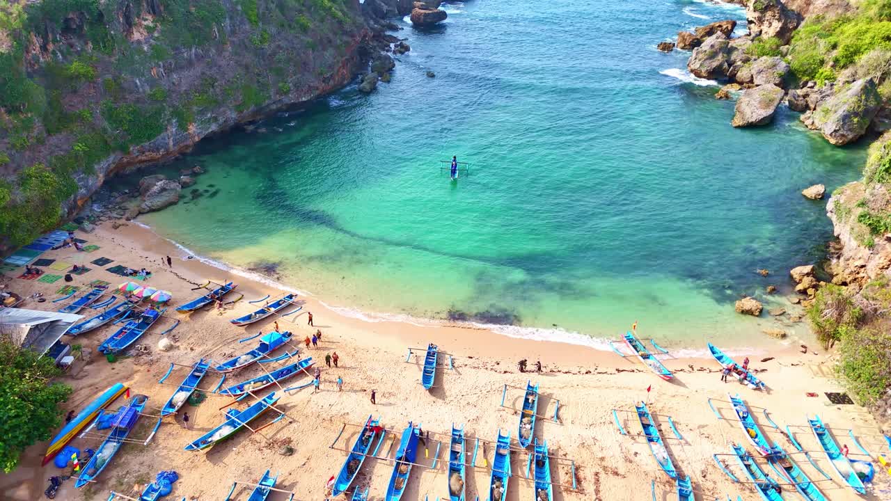 Aerial View of Secluded Tropical Beach with Fishing Boats