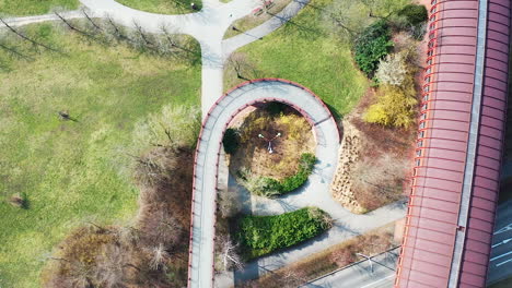 top down aerial view of central park and metro tube, west prague, czech republic on sunny day and spiral pathway