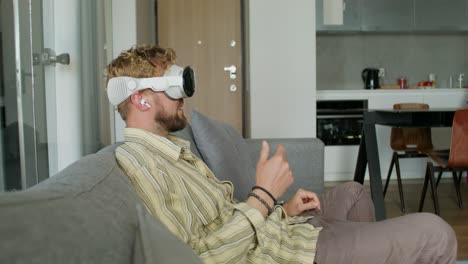 man using vr headset at home