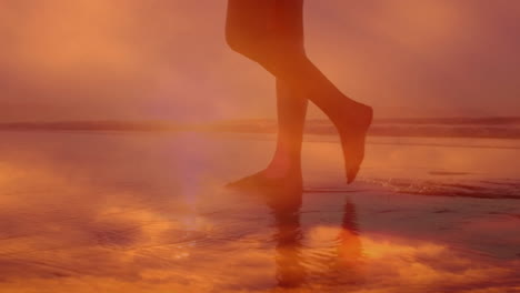 woman walking on sandy beach at sunset, with animated health icons reflecting wellness data