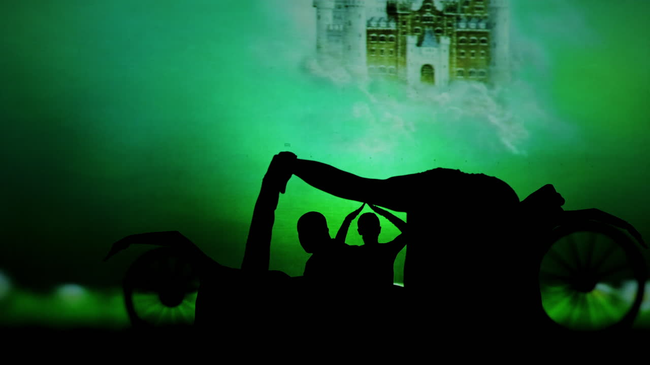 Silhouette of a car with people on a green background