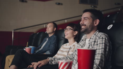 friends enjoying a movie at the cinema