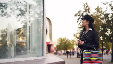 woman shopping at street store