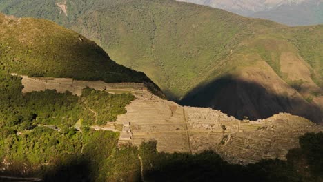 machu picchu from a distance in shade