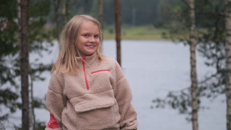 portrait shot of happy norwegian girl outdoors in nature of norway