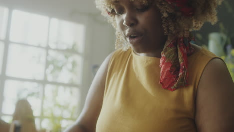 female culinary blogger preparing food and talking on camera