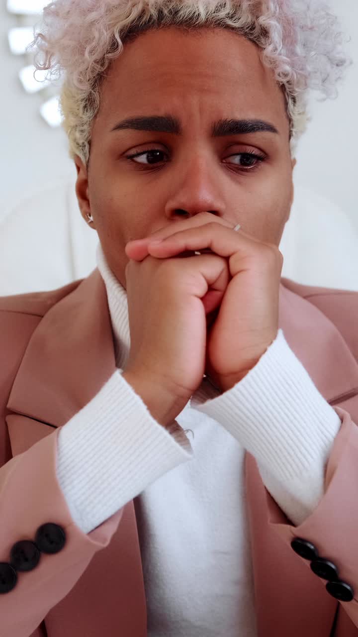Close up portrait of a thoughtful young woman looking worried and pensive