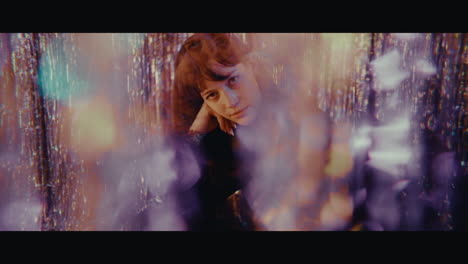 mysterious woman in a purple glitter setting