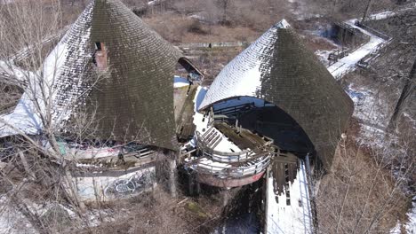 derelict old zoo building with high rooftop in michigan, aerial view